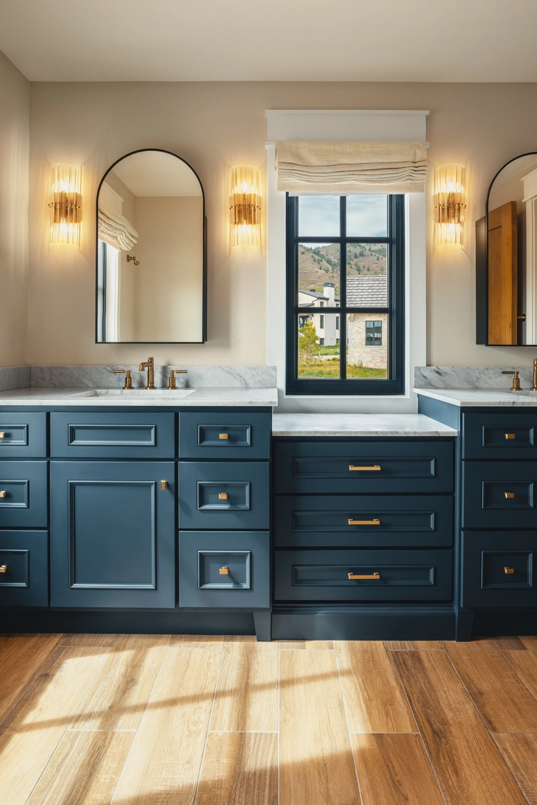 Beautifully remodeled kitchen with a large island featuring a sleek stove with maple blend cabinets in the Laramie door style, painted in the neutral shade of Prairie Dove.